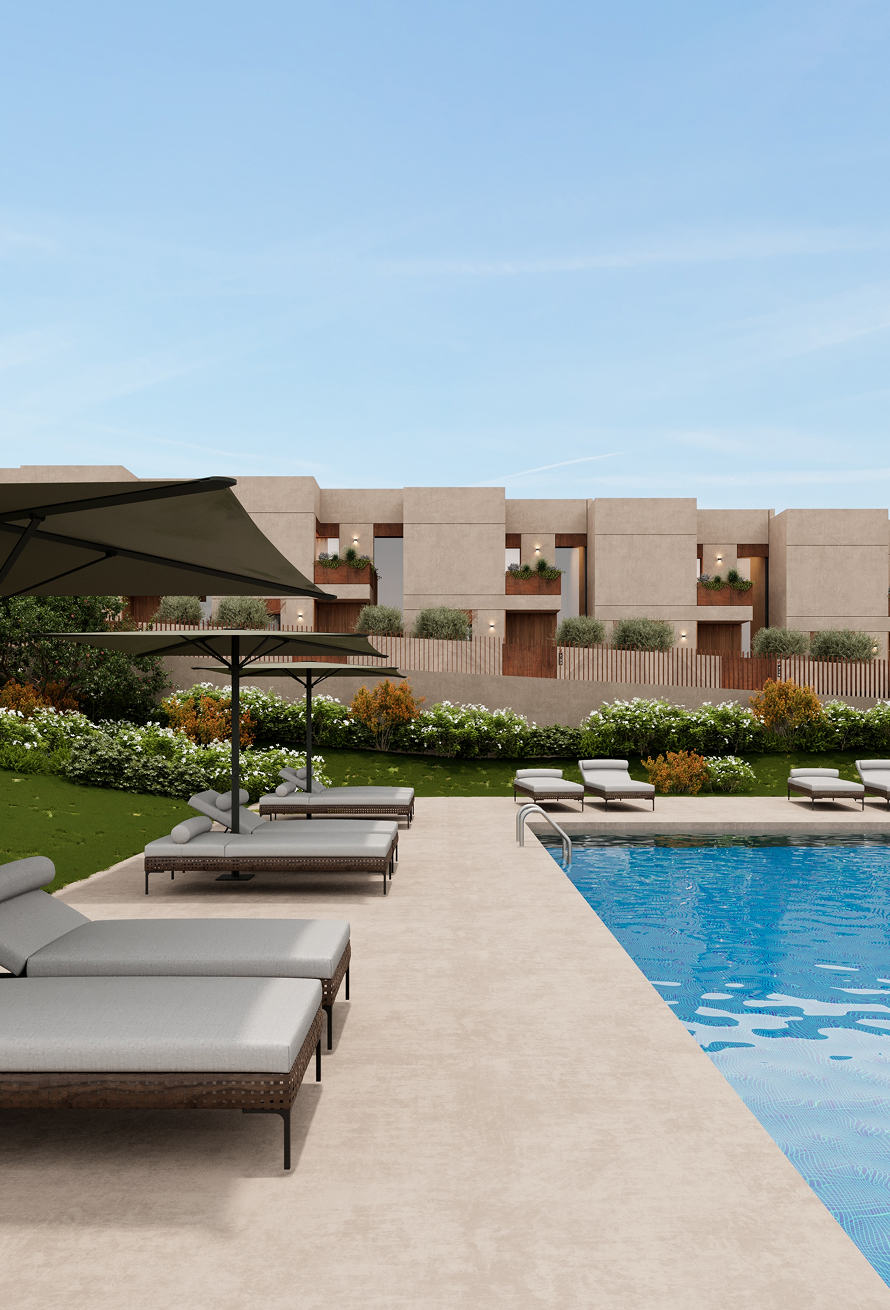 Pool deck with loungers and parasols facing the sand-coloured facades of Villa Ribela in Maia