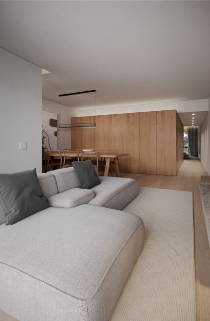 Living room render of the Moledo Apartment in Viana do Castelo, a low sofa in front of the dining space