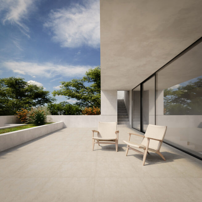 ST House, Santo Tirso: terrace with two armchairs beneath the overhanging white volume, an outdoor stair behind