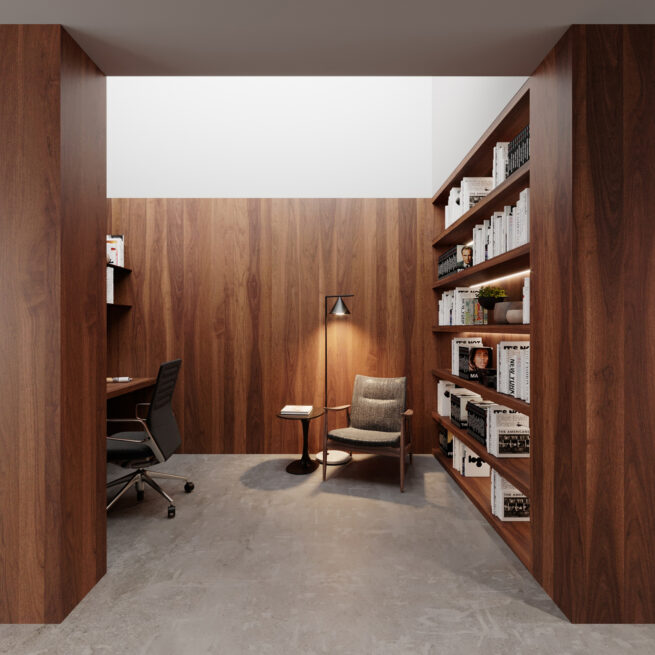 ST House, Santo Tirso: study with a desk and reading chair, enclosed by warm wood-toned panelling and shelves