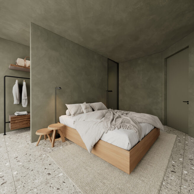 Guest House 207, Paredes: bedroom with a wooden bed, small stool and open clothes rail set against green walls