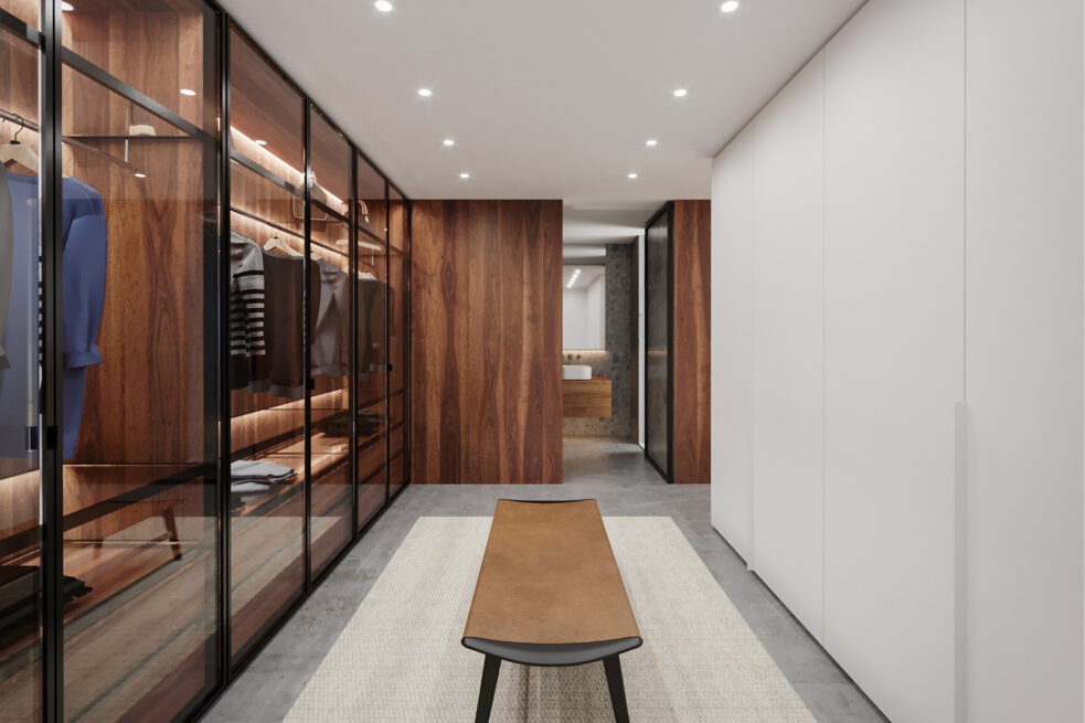 ST House, Santo Tirso: walk-in wardrobe with glass-fronted cabinets and a wooden bench along the room
