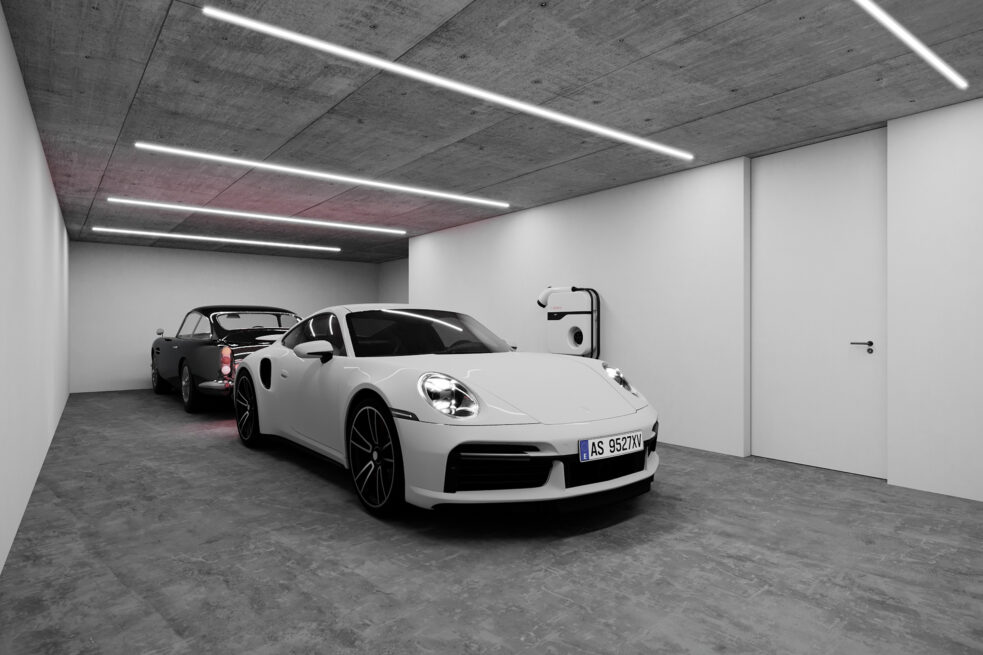 Chieiras House, Vila Nova de Gaia: render of the basement garage with two cars under linear ceiling lights