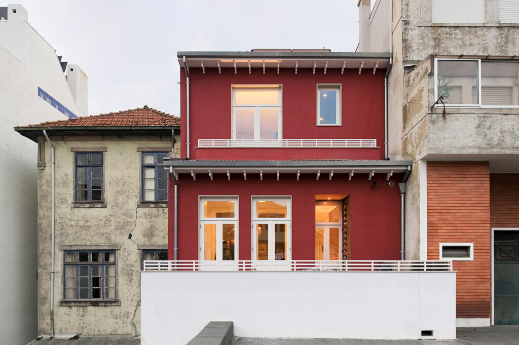 MM House by Spaceworkers, a red-rendered townhouse facade