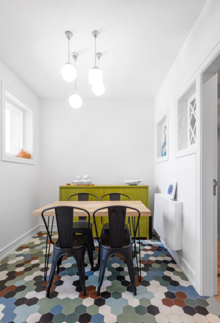 Combatentes House, Porto: breakfast room with a lime-green sideboard and multicoloured hexagonal tiles